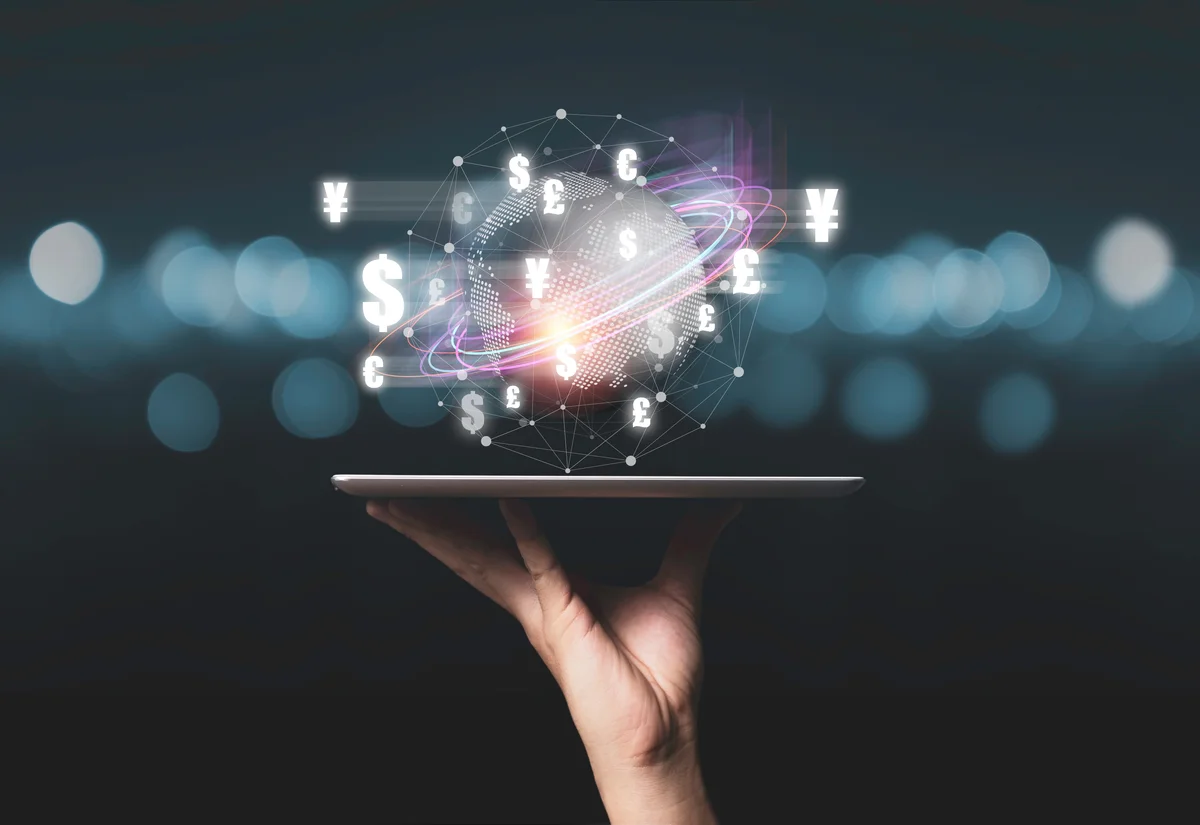 Digital tablet displaying global financial network with currency symbols for foreign exchange services